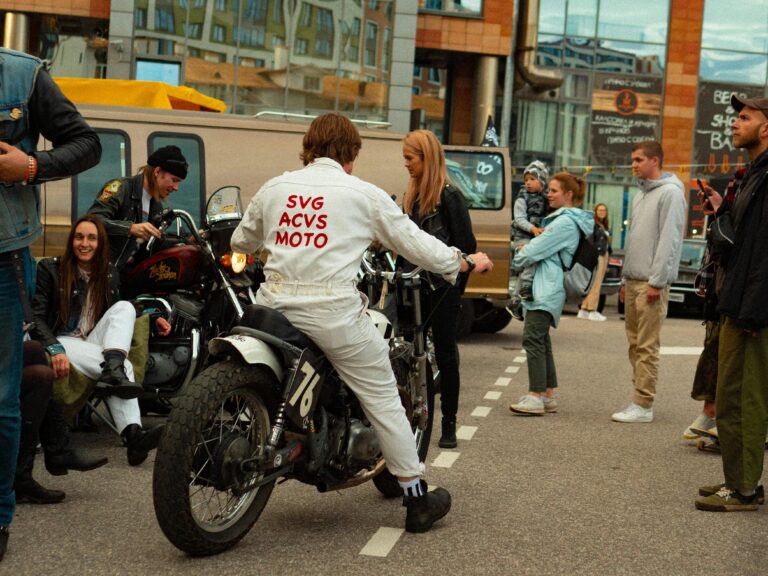 Projects 3 Motorcycle enthusiasts gather at an urban street event, showcasing bikes and culture.